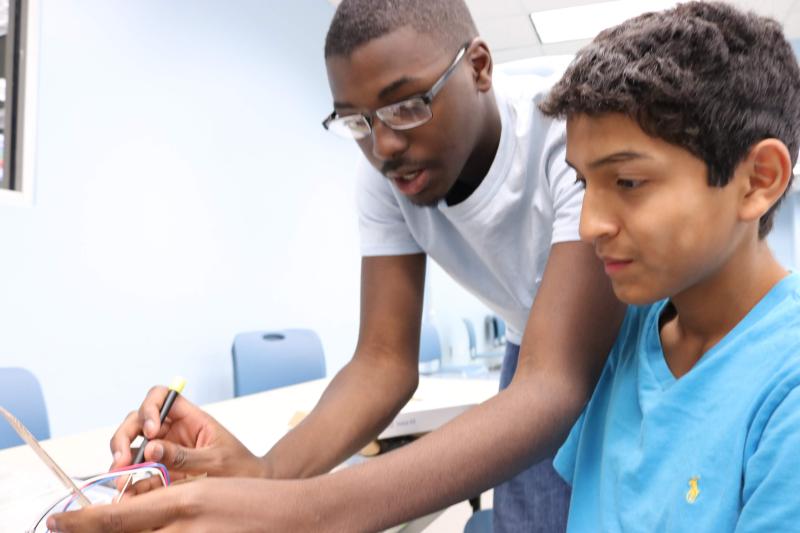 Adults and teen working together 