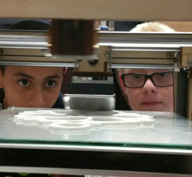 Kids using a 3D printer