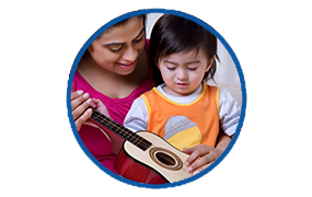 mother holding child holding musical instrument