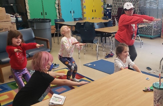 children exercising with a teacher at Westlawn SACC 