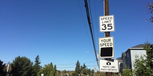 School and construction zone speeding to be enforced by camera during pilot program.. Speed limit warning sign.