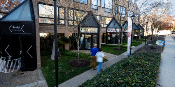 small businesses along a street with sidewalk