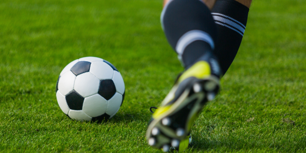 kicking a soccer ball