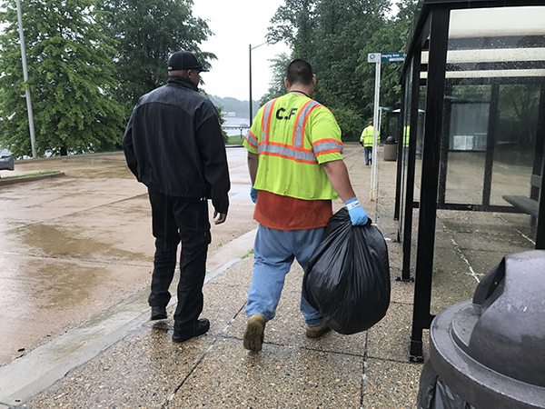 Community Labor Force worker picking up trash