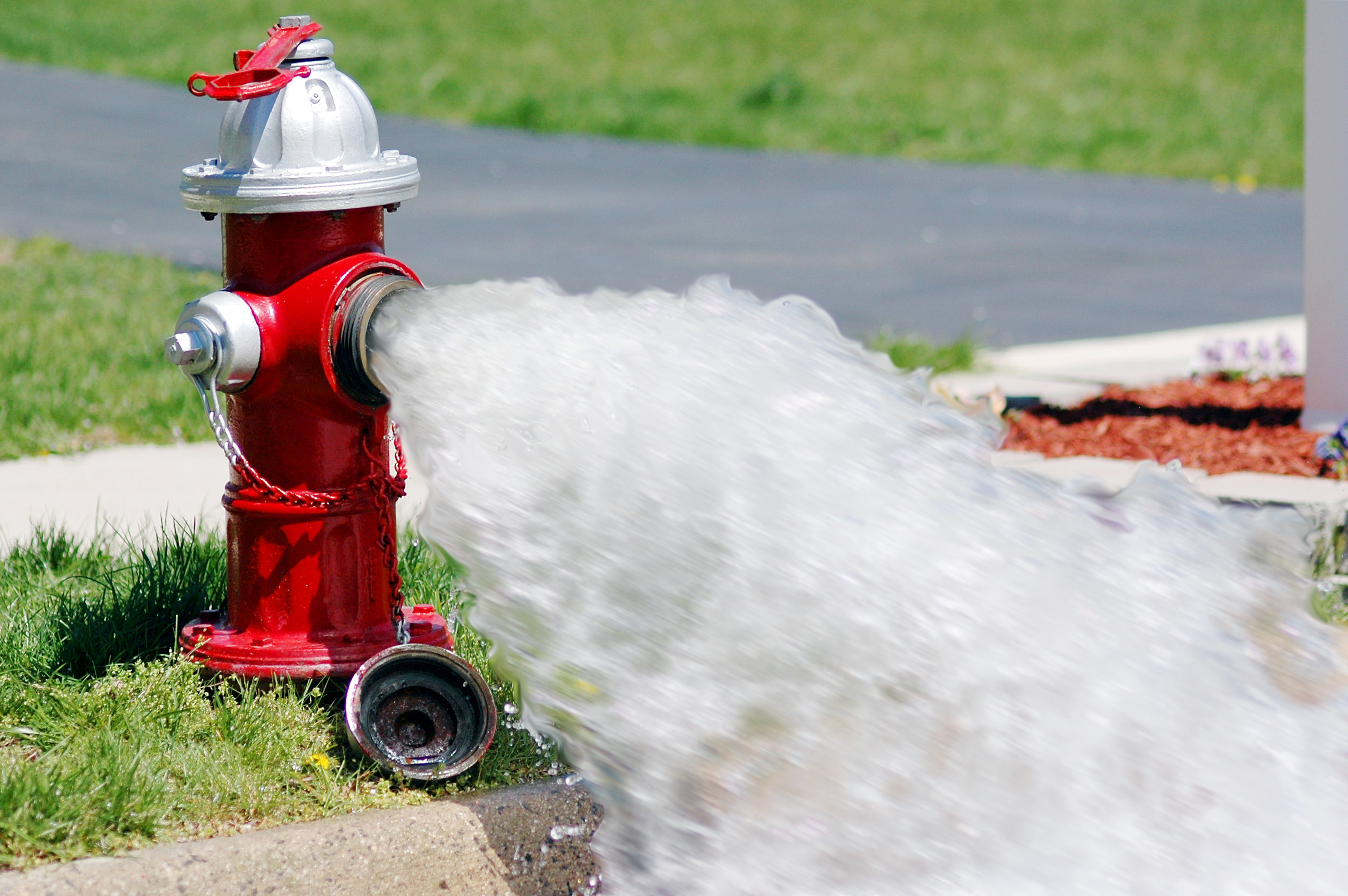 fire hydrant releasing water fire hydrant releasing water