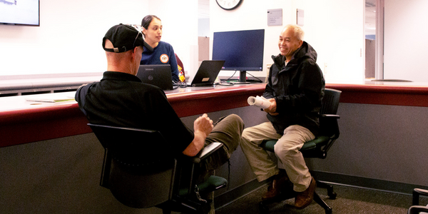 county staff member assisting a resident with permits county staff member assisting a resident with permits
