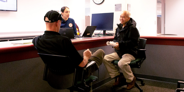 county staff member assisting a resident with permits 