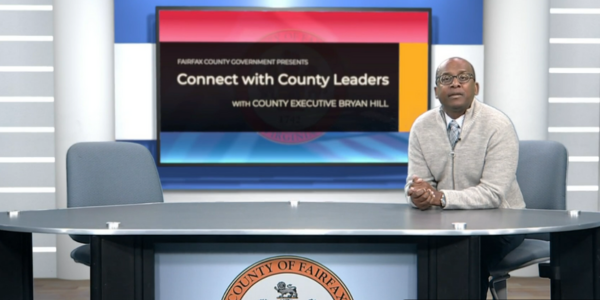 Image of County Executive Bryan Hill sitting at a desk with the Fairfax County seal. Image of County Executive Bryan Hill sitting at a desk with the Fairfax County seal.