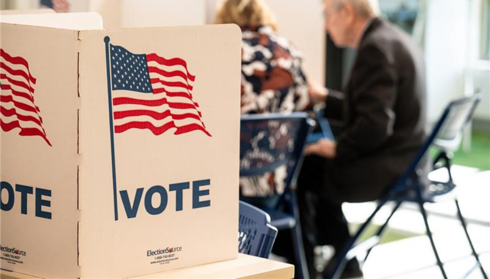 Voting divider with the text "VOTE" and a graphic of an American flag. Voting divider with the text "VOTE" and a graphic of an American flag.