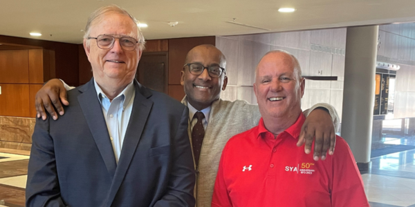 Image of Fairfax County Executive Bryan Hill with Mark O’Meara and Gary Flather.