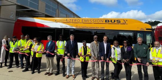 ribbon cutting by county officials in front of new electric buses