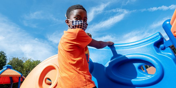 student at FCPS playground student at FCPS playground