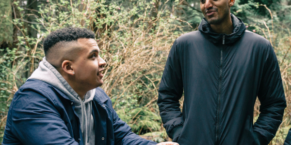 a photo of two men talking