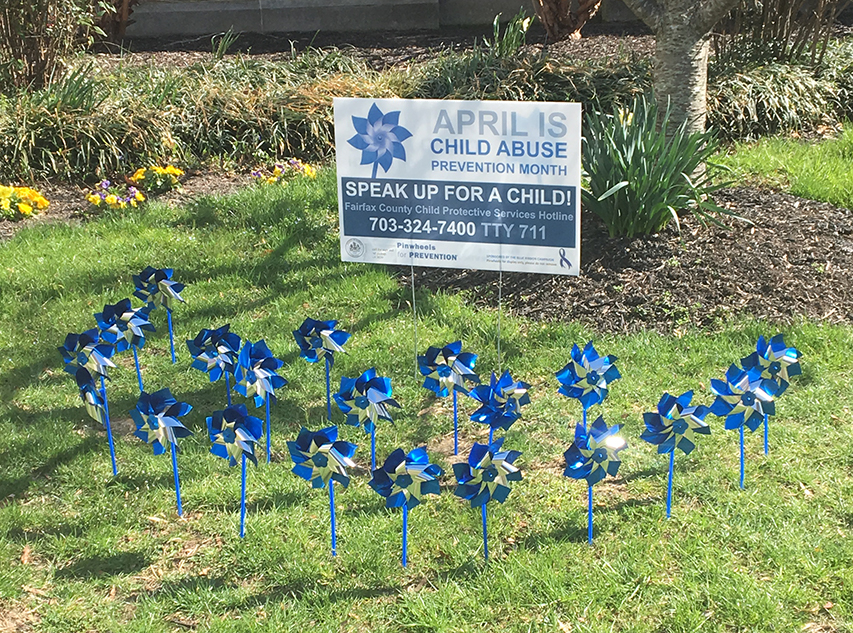 pinwheel garden and sign at Sherwood library, 2019