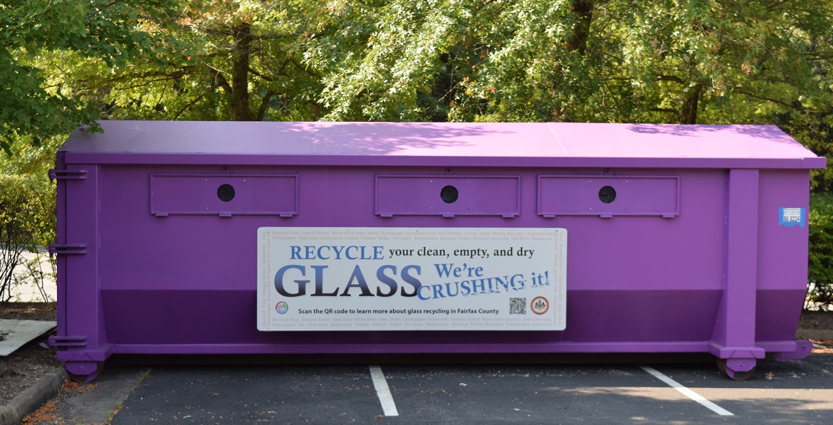 purple glass recycling bin in parking lot purple glass recycling bin in parking lot