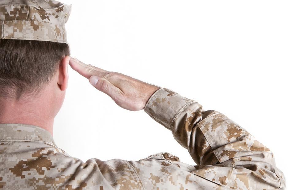 military member saluting, back to camera