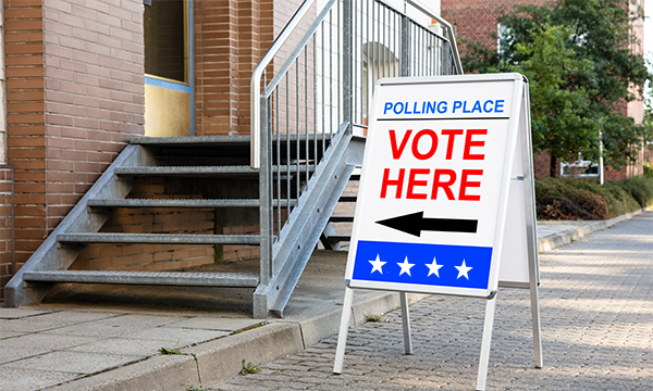 Polling place sign that says vote here.