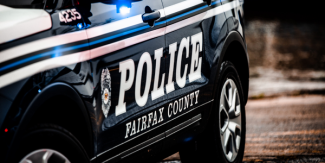 Image of the side of a Fairfax County police car