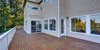 Image of a wooden deck on the back of a home.