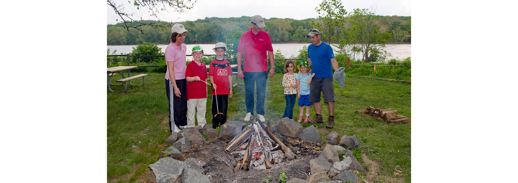 Youngsters roast marshmallows 'round a campfire