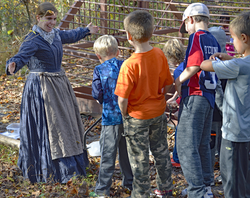 A docent in costume leads a tour at ECLP