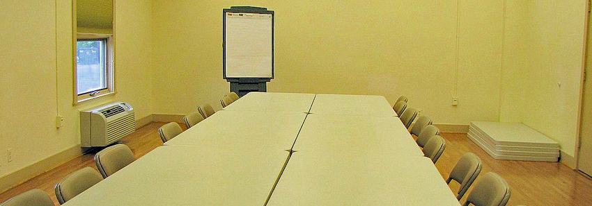 Tables arranged in a long row in the classroom