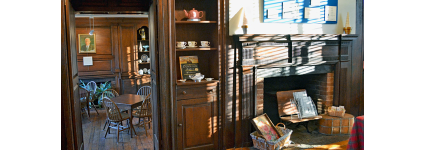 Fireplace, tables and knickknacks inside Green Spring's Historic House