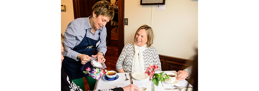 one person serving another person downton fashion tea
