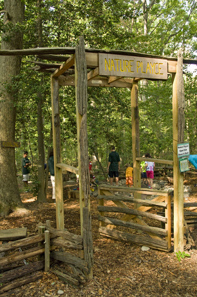 Several children play inside the Nature Playce entryway