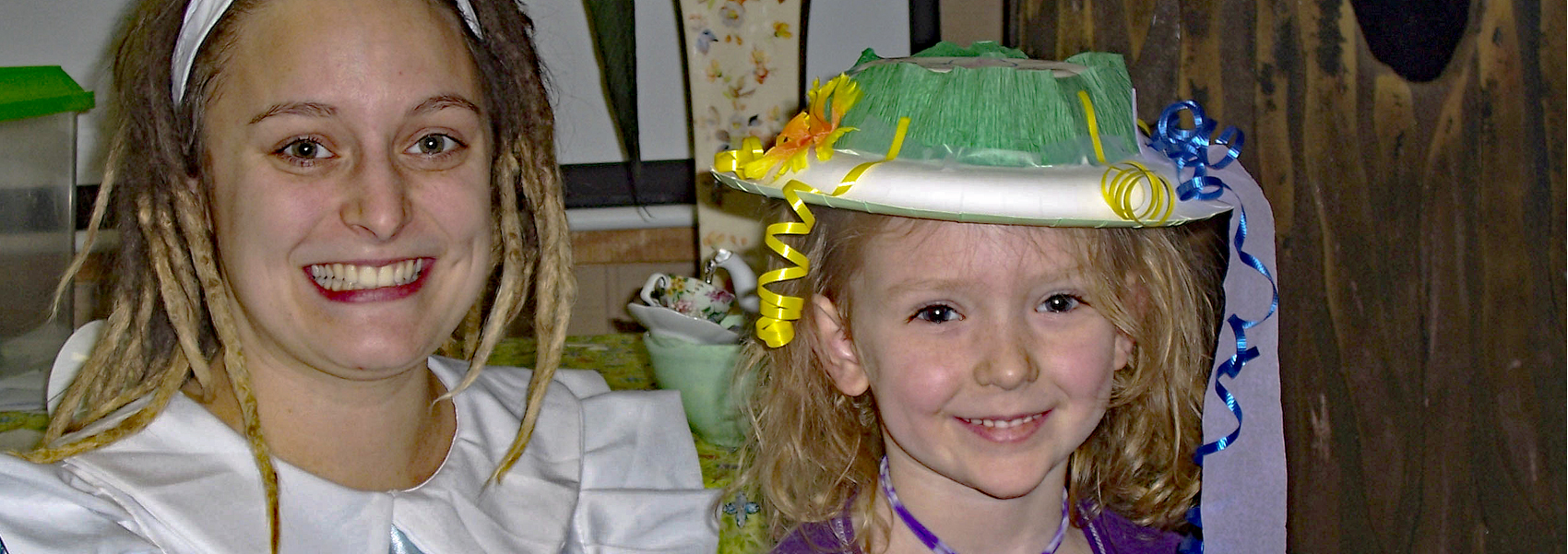 A young woman and young girl play dressup at Hidden Oaks