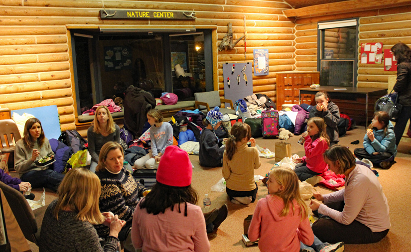 A Girl Scout troop gathered in Riverbend's nature center for a sleepover