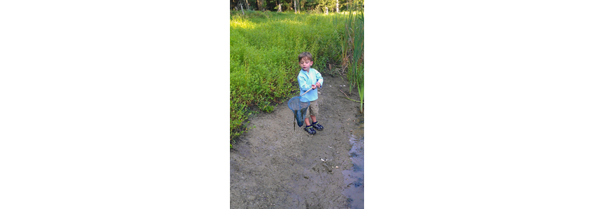 Child hiking on a trail