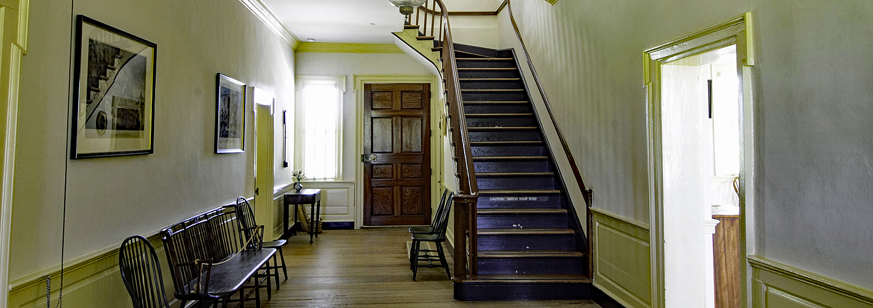 Hallway with stairs inside Sully's main house