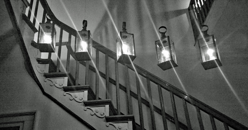 Lights suspended along a curving stairway inside Sully's historic house