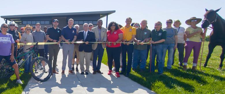 People cut ribbon on new facility
