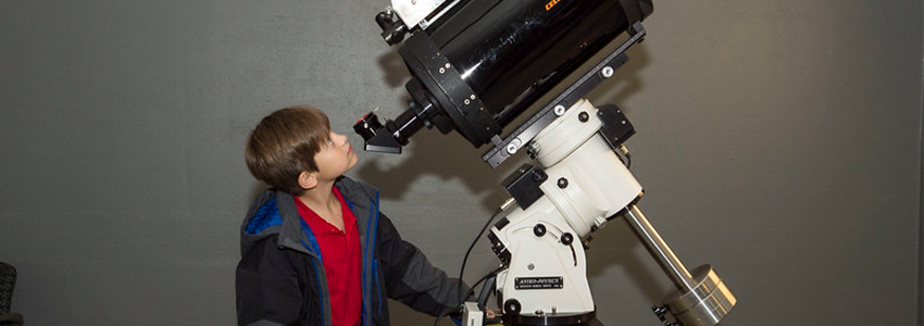 child using the observatory telescope