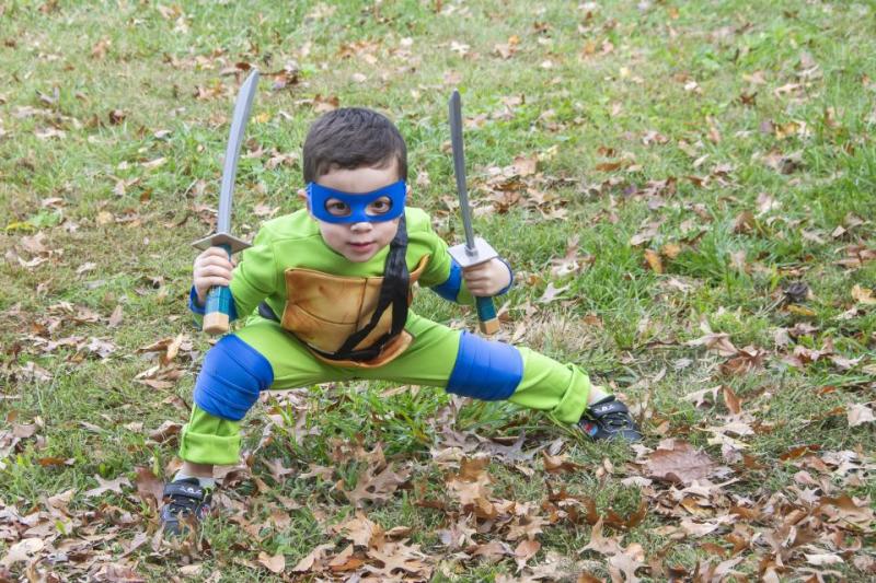 a little boy in ninja costume