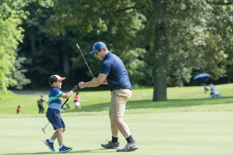 child playing golf