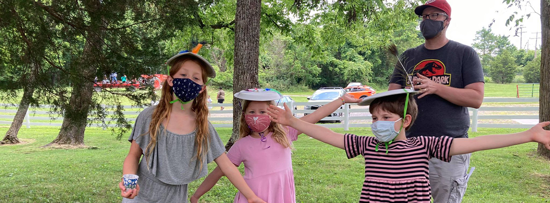 children with handmade hats on Juneteenth