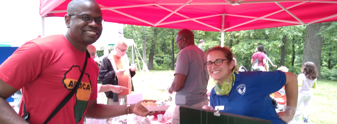 some people posing under a tent on Juneteenth