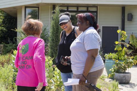 Three people talking about gardening