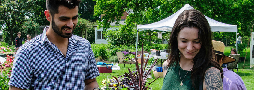 two people exploring the seedling sale at Green Spring Gardens