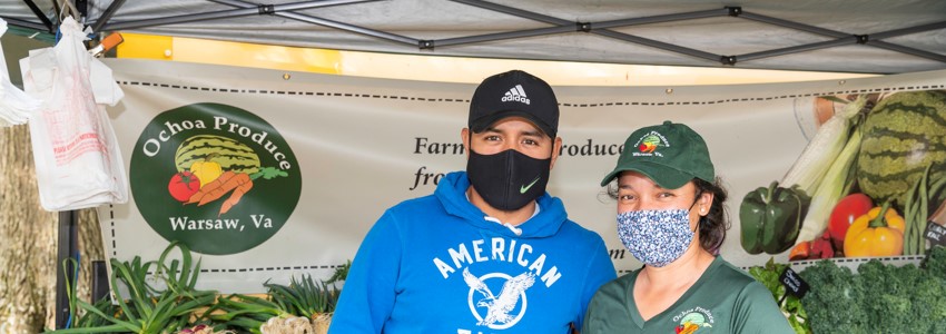 two vendors from Ochoa Produce at Mt. Vernon Farmers Market