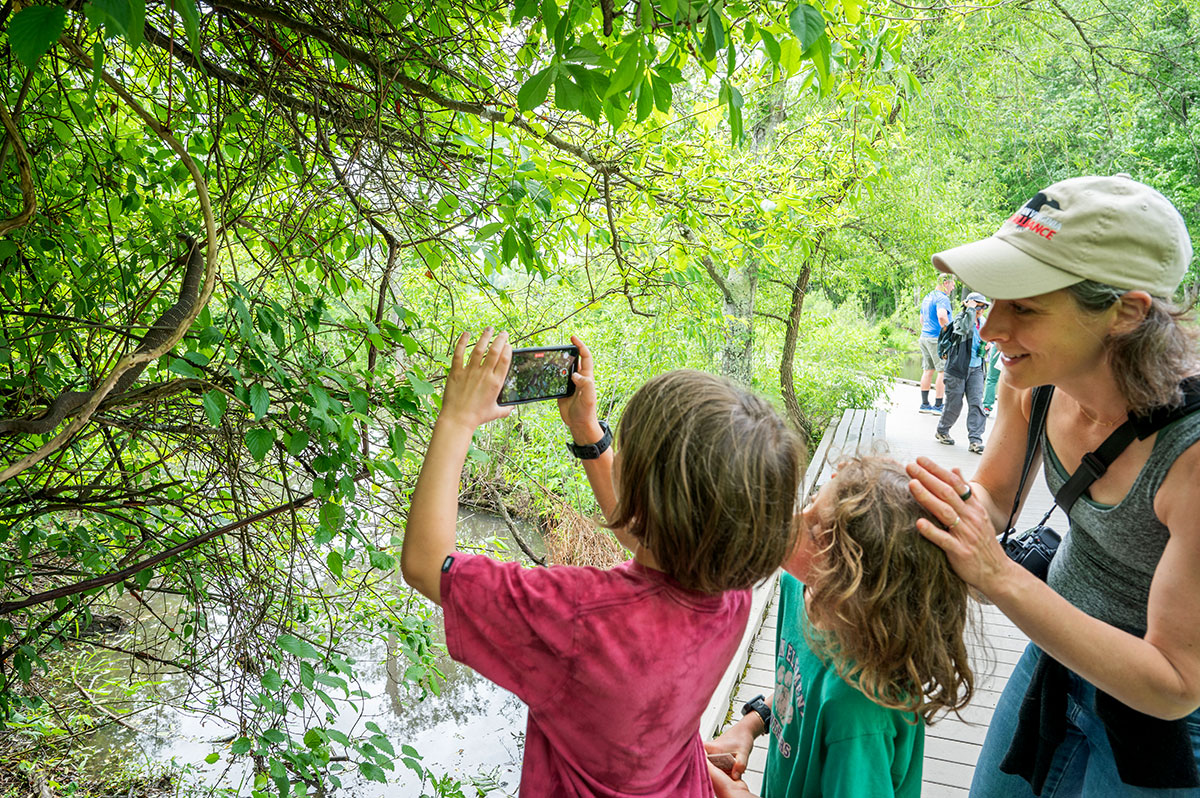 family taking photo of nature