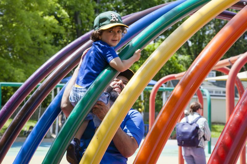 image of father and child at the playground