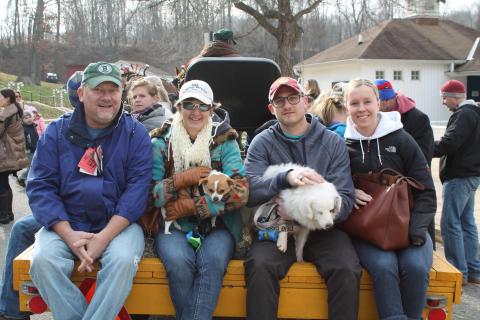 people holding dogs