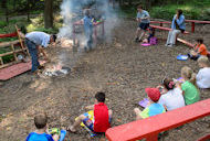 Campers around fire pit