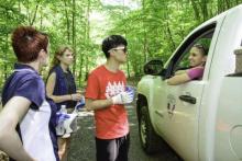 Park Staff talks to park goers Park Staff talks to park goers