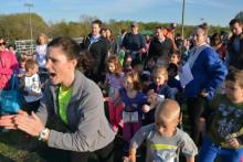 People cheering on runners People cheering on runners