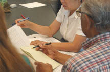 two people reviewing papers